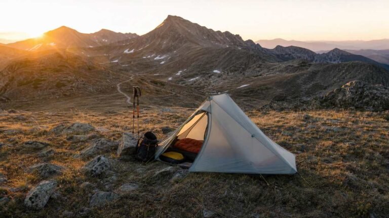 Lightweight hiking tent pitched on a mountain ridge at dawn in Australia