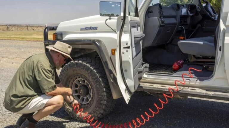 Best Tyre Deflators & Air Compressors Australia 6 Automatic tyre deflators fitted to 4WD wheels at a beach driving access point