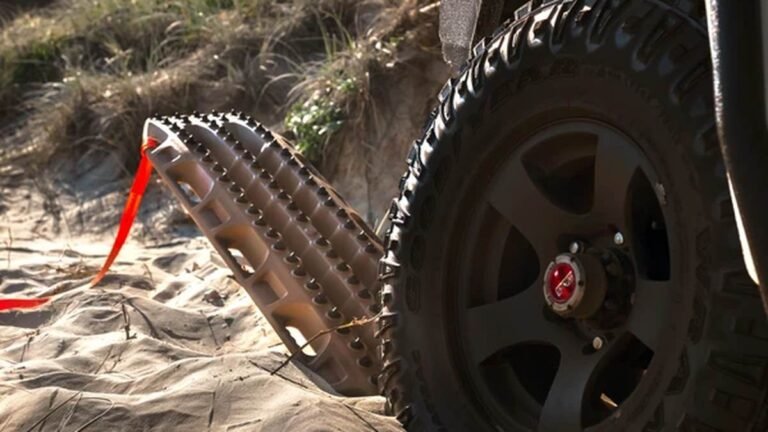 Essential Recovery Gear for Outback Touring 3 4WD recovery in progress with recovery boards and snatch strap on a sand track